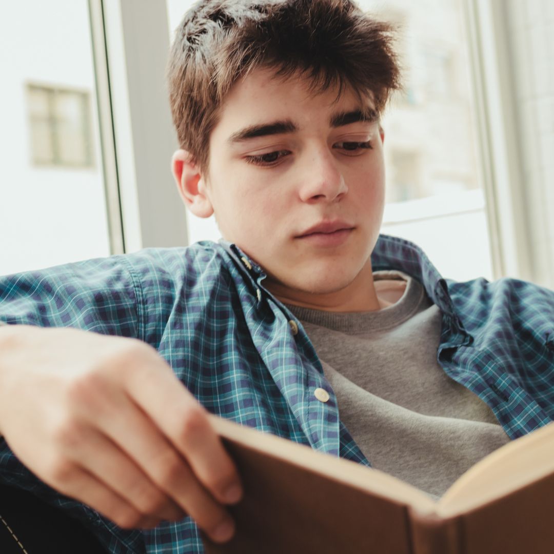 Teen boy reading