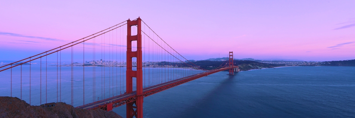 San Francisco Golden Gate Bridge with a purple and pink sky