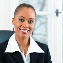Paralegal smiles at her desk