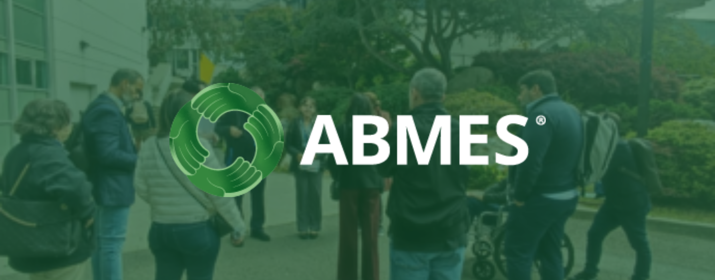 AMBES logo over a group touring the SFSU campus