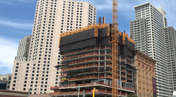 A building site with a crane in downtown San Francisco